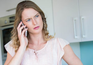 A concerned woman on the phone