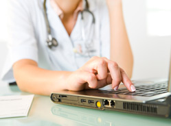 picture of a woman doctor on a laptop
