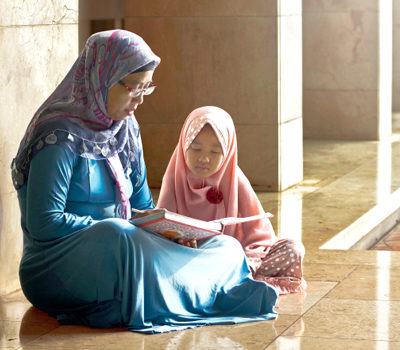 A mother reading to her daughter