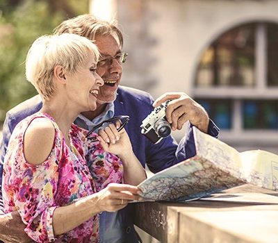 A man and woman looking at a map