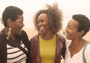 3 women smiling 