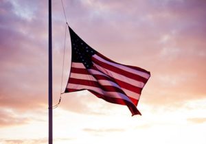 An American flag being flown at half-mast