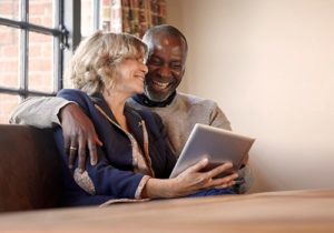 man and woman on laptop