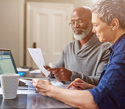 An older couple reviewing a social security benefit statement