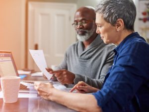 An older couple reviewing a social security benefit statement