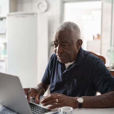 Senior man working at laptop
