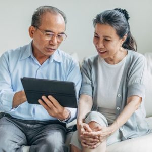 couple reviewing information on a tablet