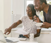 Senior couple reviewing information online