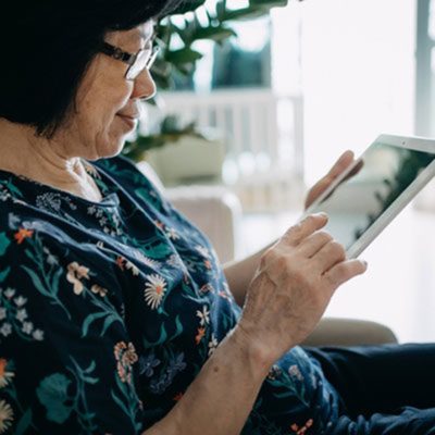 woman checking Medicare information on a tablet