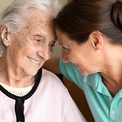 Dementia and Occupational Therapy - Home caregiver and senior adult woman.