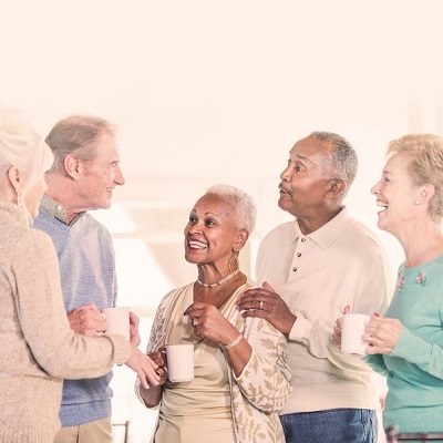 older adults standing and talking